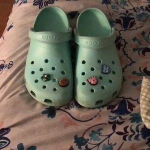 Teal crocs with jibbitz